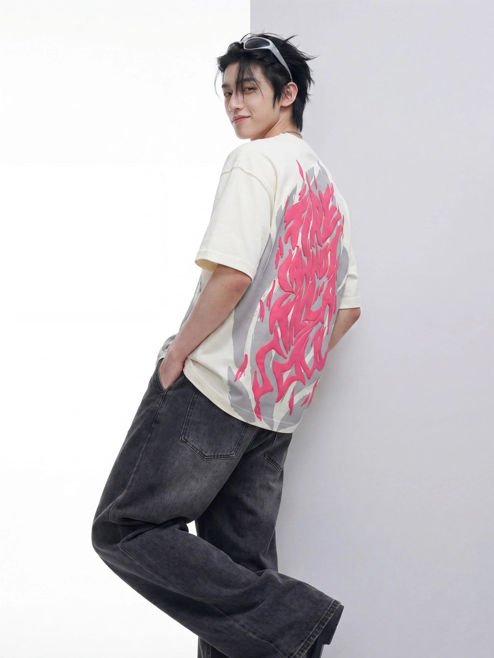 Front view of BLACKTAIL After Burn oversized off-white French Terry T-shirt with grey artwork and pink puff print.